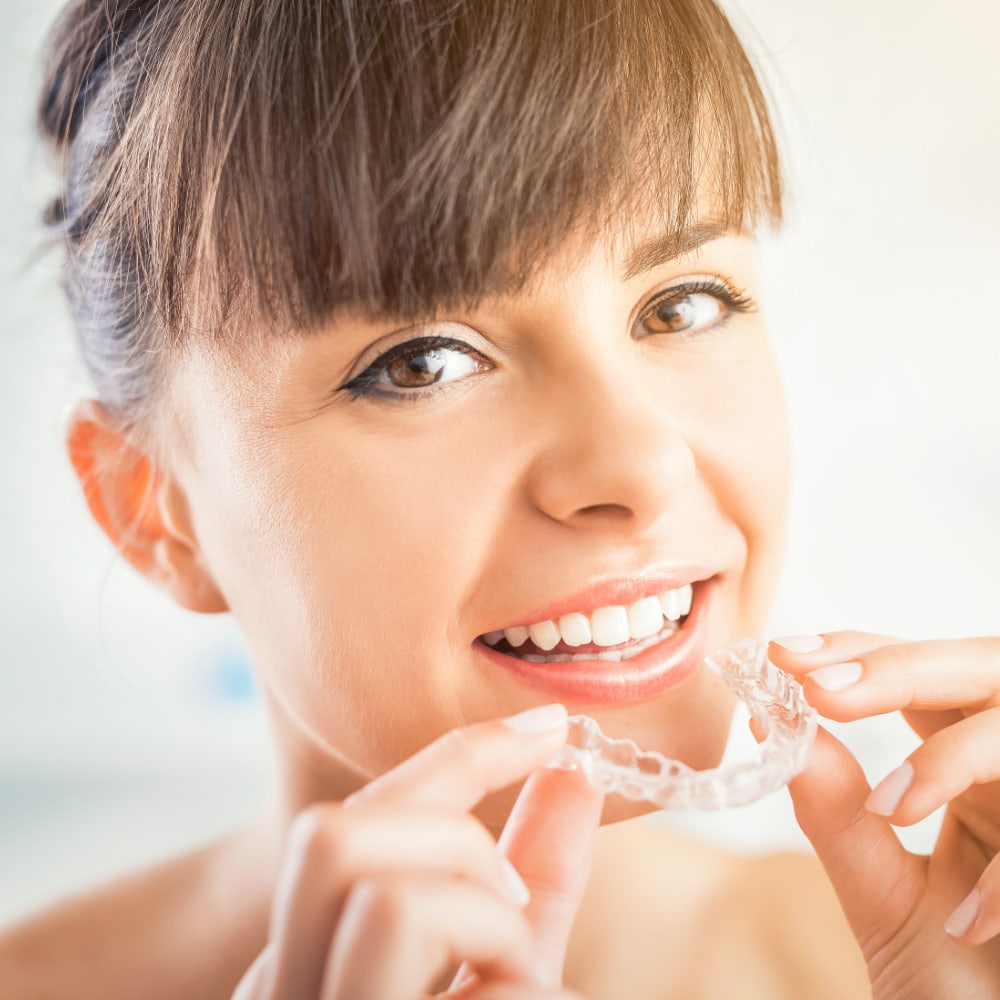 Smiling patient wearing clear aligners for Invisalign in Ponte Vedra Beach